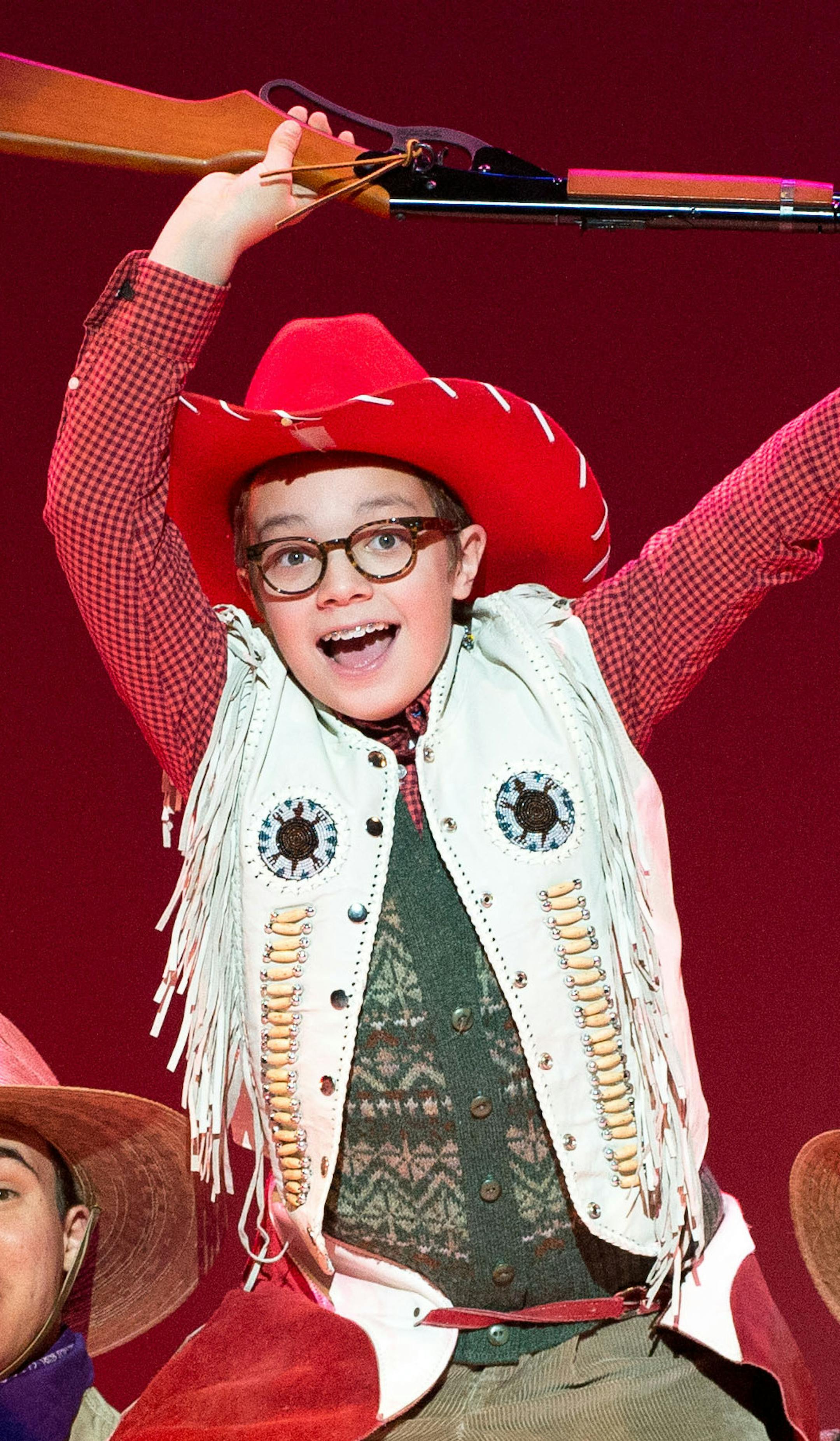 Ralphie Parker, played by Jake Goodman, is hoisted onto the shoulders of cowboys played by Jack Ahern, left and Tony Vierling, during the number "Ralphie to the Rescue." ] AARON LAVINSKY • aaron.lavinsky@startribune.com Dress rehearsal of the Ordway Production of "A Christmas Story: The Musical" on Saturday, Nov. 29, 2014 at Ordway Theater in St. Paul.