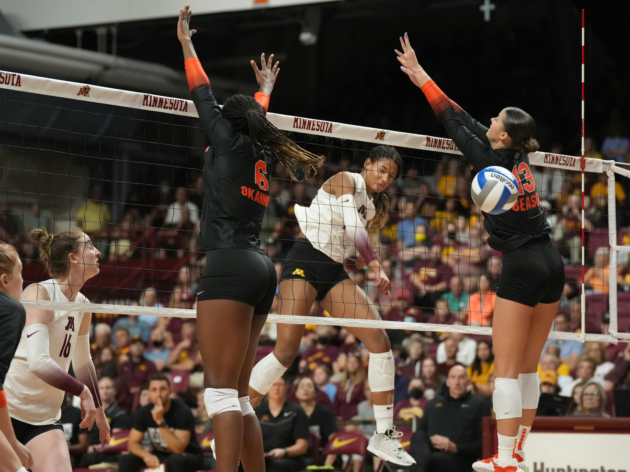 Gators Nnedi Okammor(6) and Merritt Beason(13) try to block a a shot by Gophers Taylor Landfair(12) in Minn., on Sunday, Sept. 4, 2022. Gophers take on Florida in the home volleyball opener at Maturi Pavilion. ] RICHARD TSONG-TAATARII • richard.tsong-taatarii@startribune.com