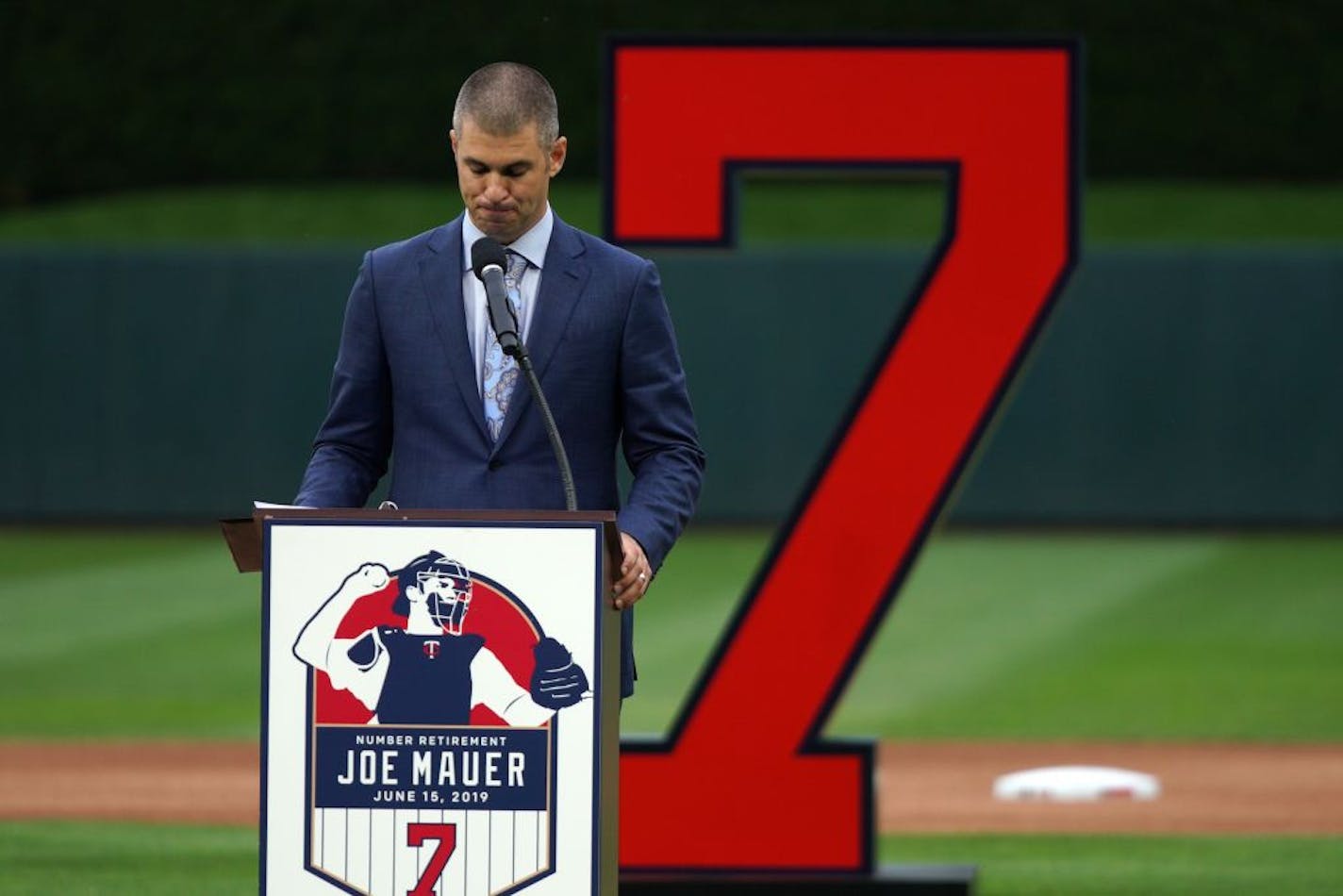 Former Minnesota Twins star Joe Mauer fought back tears as he spoke during a pregame ceremony to retire his number 7 Saturday.