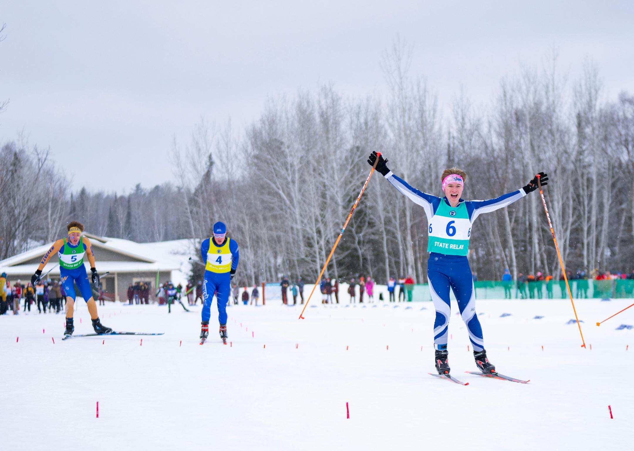 Bemidji nordic skier Reed Kuzel (6) celebrates as he crosses the finish line to take second place in the boy's team sprint final during the MSHSL Boys and Girls Nordic Ski Racing Meet.