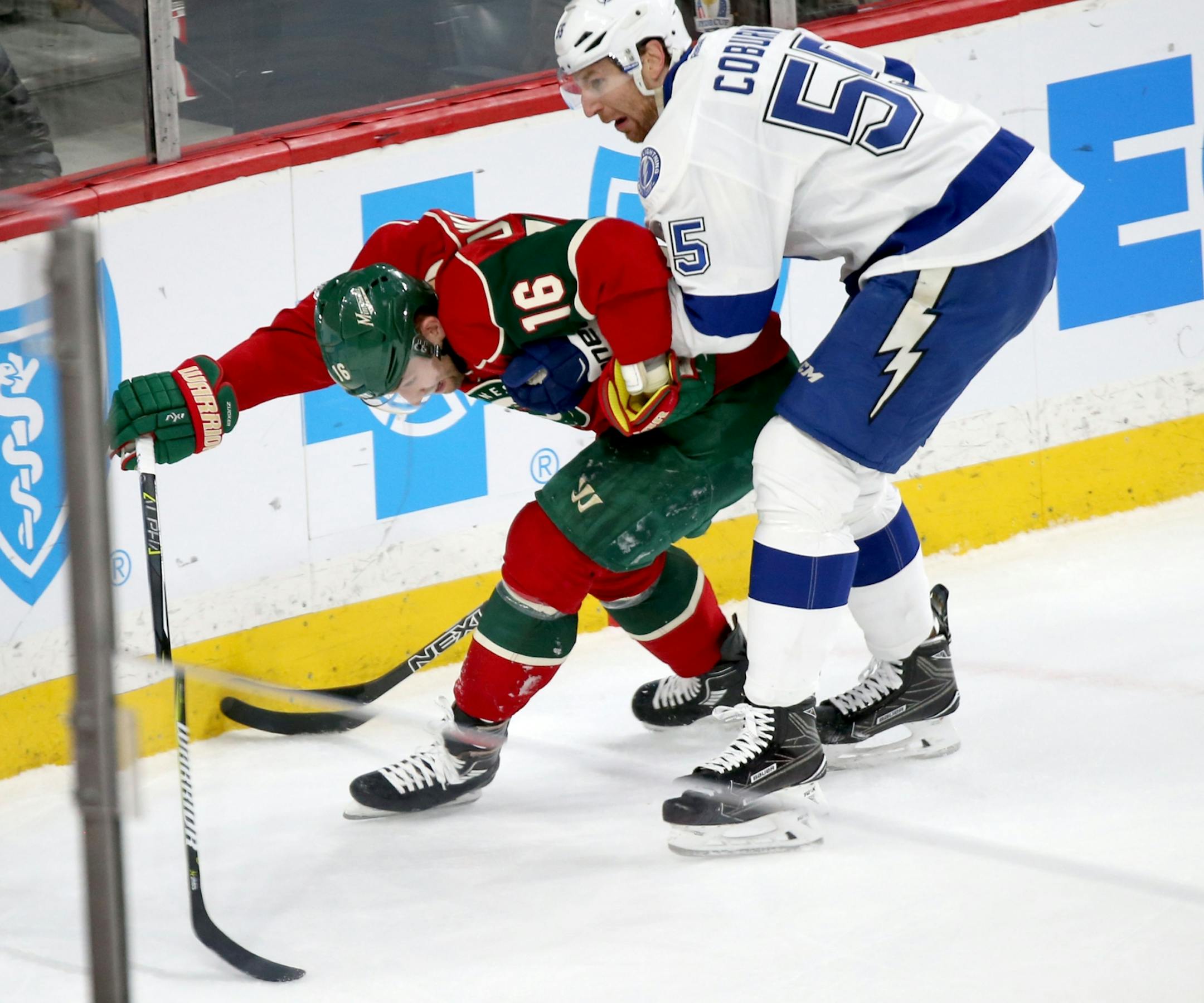The Minnesota Wild's Jason Zucker (16) tangles with Tampa Bay's Braydon Coburn (55) in the first period Friday, Feb. 10, 2017, at the Xcel Energy Center in St. Paul, MN.
