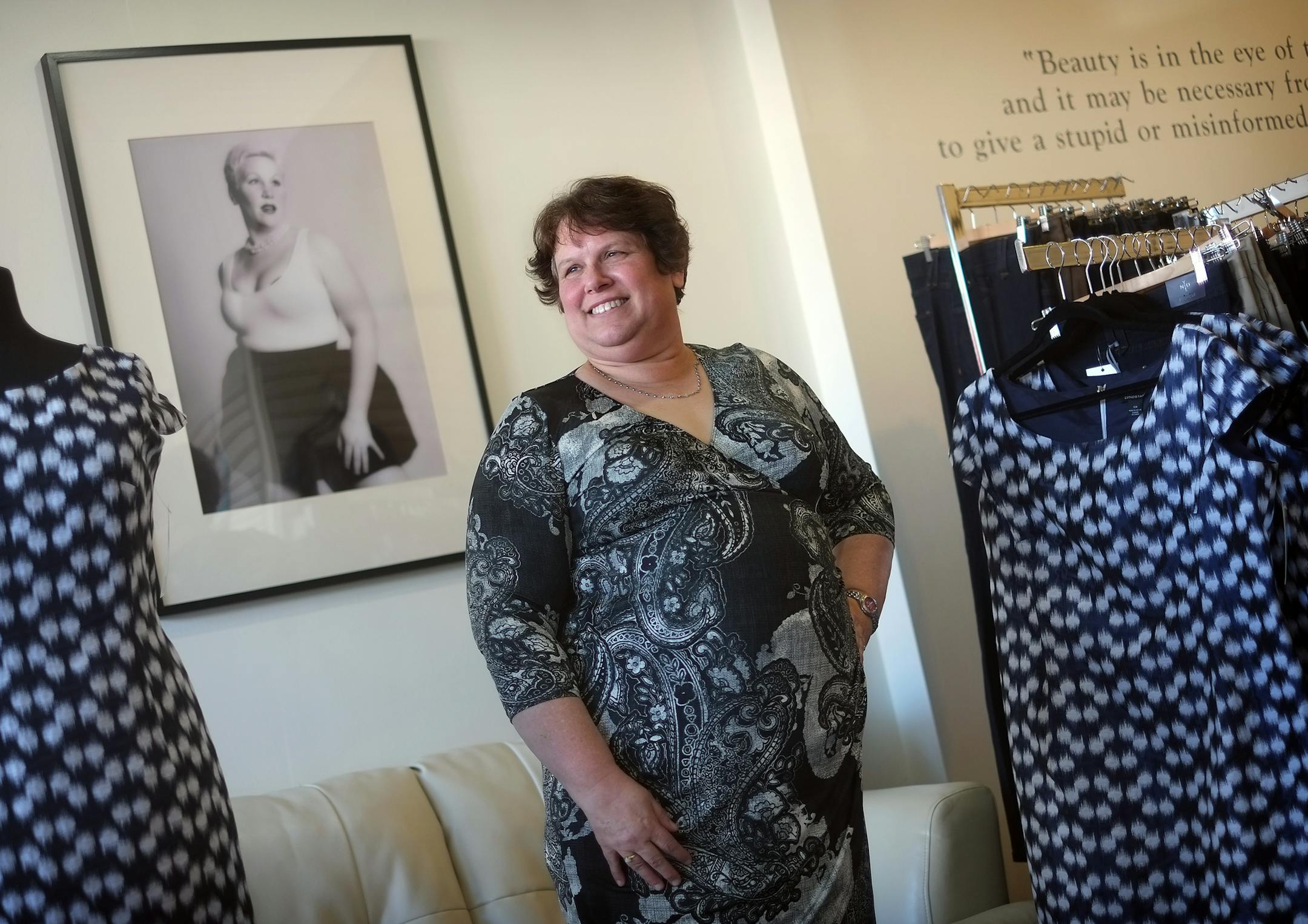 At the Bombshell, a plus-size boutique in St. Paul, customer, Wendy Hull, modeled flattering plus-size fashions. ] TOM WALLACE • twallace@startribune.com _ Assignments #20027679A_ February 19, 2013_ SLUG: 90980 PLUSSIZE030213_ EXTRA INFORMATION: Photos were taken on location at the Bombshell store. Gennae Falconer is wearing the Cherry Velvet, "daphne" dress by photo and the Kiyonna, "Whimsy" dress under the painted quote. Wendy Hull Igigi "Skye" dress in front of couch. Denise Alden, own