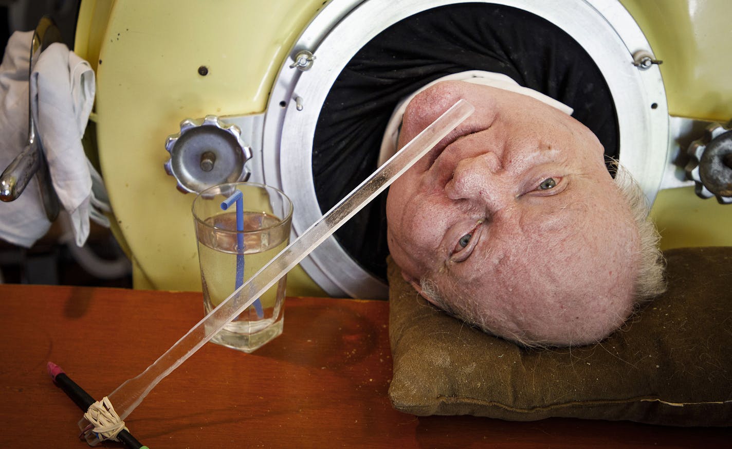 Paul Alexander looks out from inside his iron lung at his home in Dallas on Friday, April 27, 2018. Now in his 70s, Alexander is one of the few people left who uses an iron lung to help facilitate breathing for those affected by polio. (Smiley N. Pool/Dallas Morning News/TNS)