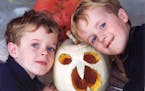 Pat Yentzer of Plymouth sent in this photo of his two young boys proudly posing with their first carved pumpkin.