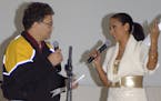 In this image provided by the U.S. Army, then-comedian Al Franken and sports commentator Leeann Tweeden perform a comic skit at Forward Operating Base