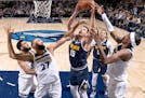 Rudy Gobert (27) of the Minnesota Timberwolves defends from Nikola Jokic (15) of the Denver Nuggets in the first half Wednesday, November 1, 2023, at 