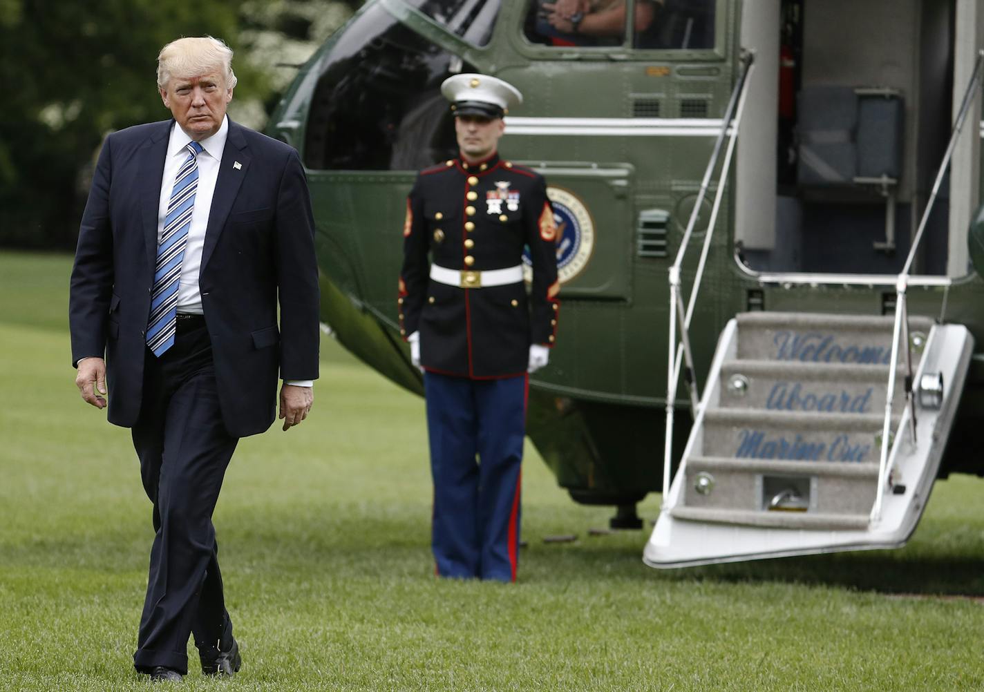 President Donald Trump arrives on Marine One on the South Lawn of the White House in Washington, Saturday, May 13, 2017, as he returns from speaking in Lynchburg, Va., at the Liberty University commencement ceremony. (AP Photo/Carolyn Kaster) ORG XMIT: MIN2017051611582715