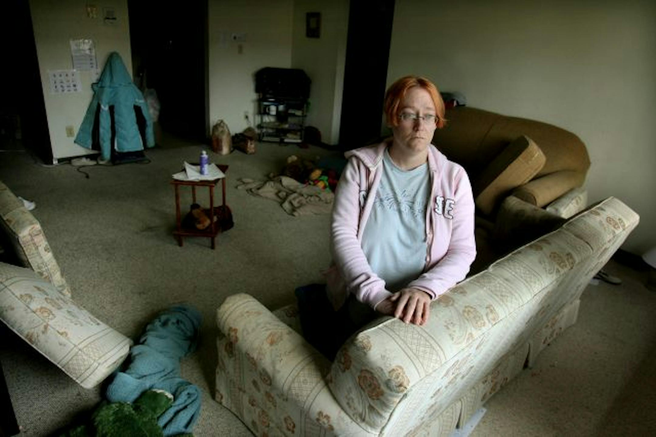 Jessica Wolf stayed close to a window to help her breathe after her landlord sprayed for bed bugs throughout the apartment. He said he is charging her $300 for the spraying.