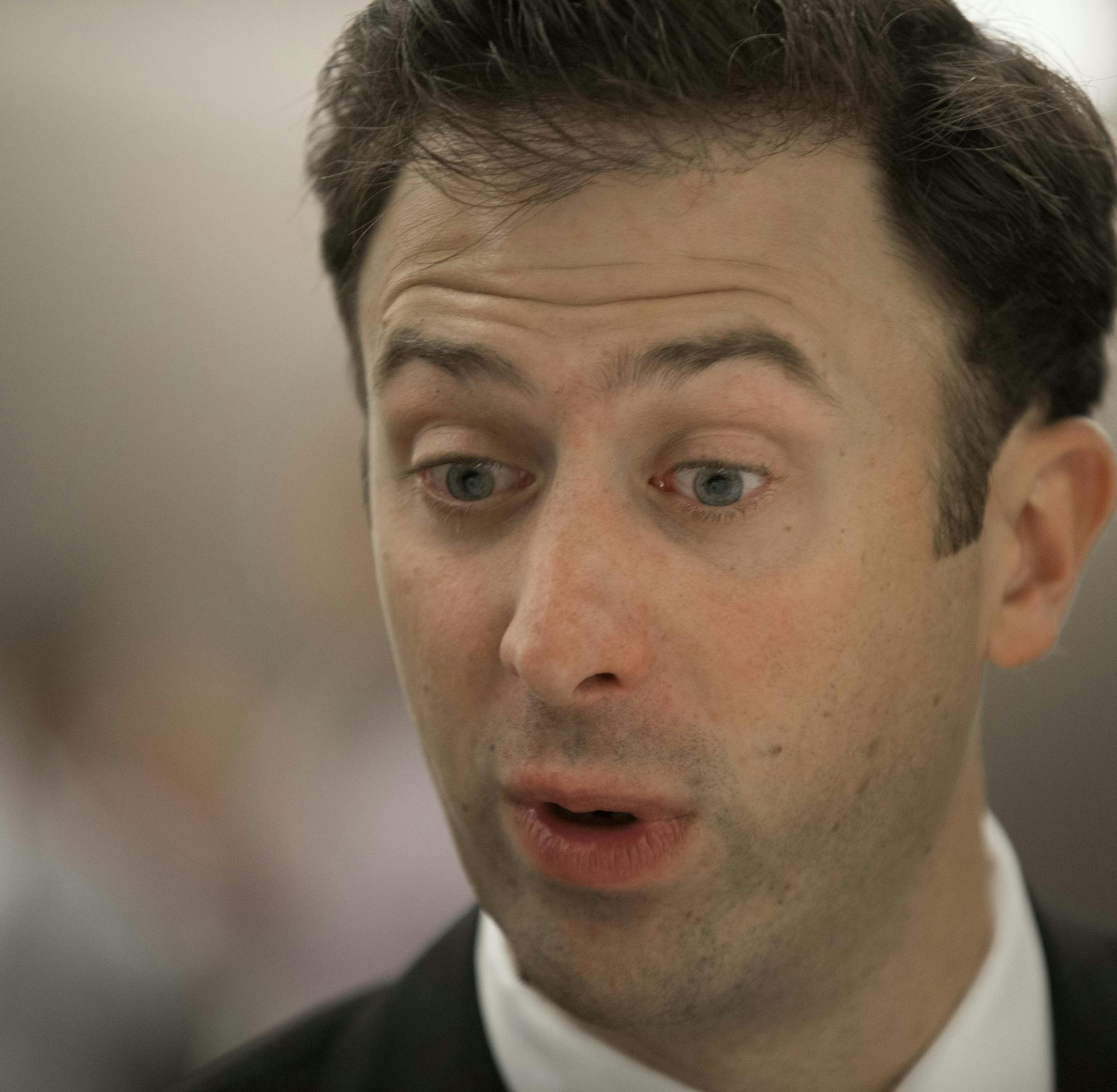 Minnesota men's head coach Richard Pitino talks with reporters during a Big Ten NCAA college basketball media day in Rosemont, Ill., Thursday, Oct. 16, 2014. (AP Photo/Paul Beaty)