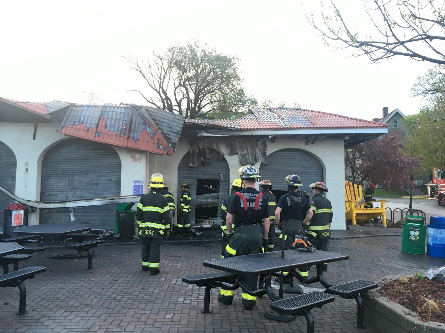 Minneapolis fire fighters inspected the damage to the pavilion and restaurant at Lake Calhoun/Bde Maka Ska caused by an early morning fire.