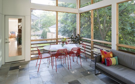 A screened porch replaced an old wooden deck on the back of the home.