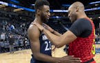 Minnesota Timberwolves Andrew Wiggins (22) spoke with Vince Carter (15) of the Atlanta Hawks at the end of the game.