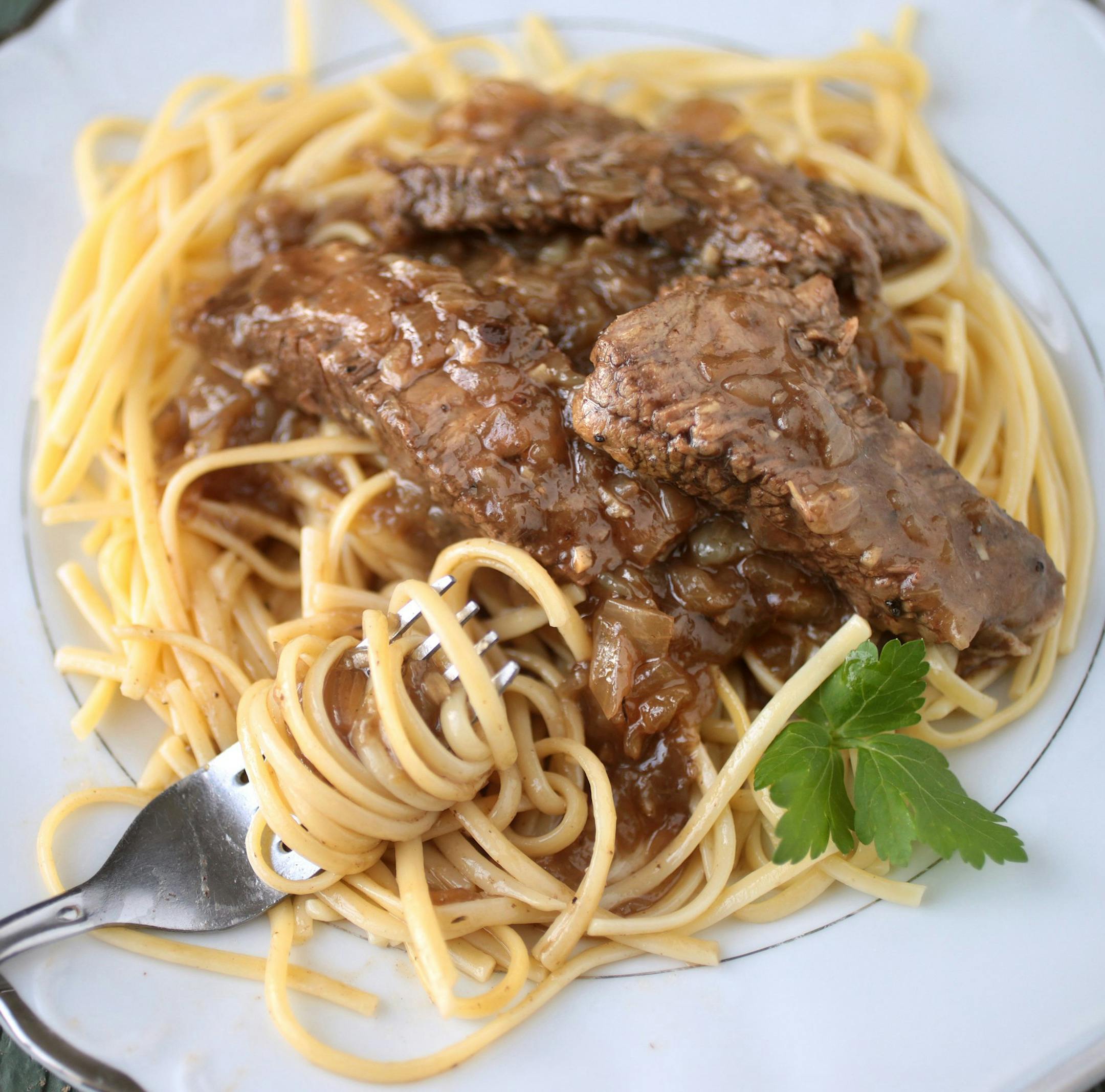Coffee-Braised Pot Roast with Caramelized Onions. (Cristina M. Fletes/St. Louis Post-Dispatch/TNS) ORG XMIT: 1197571