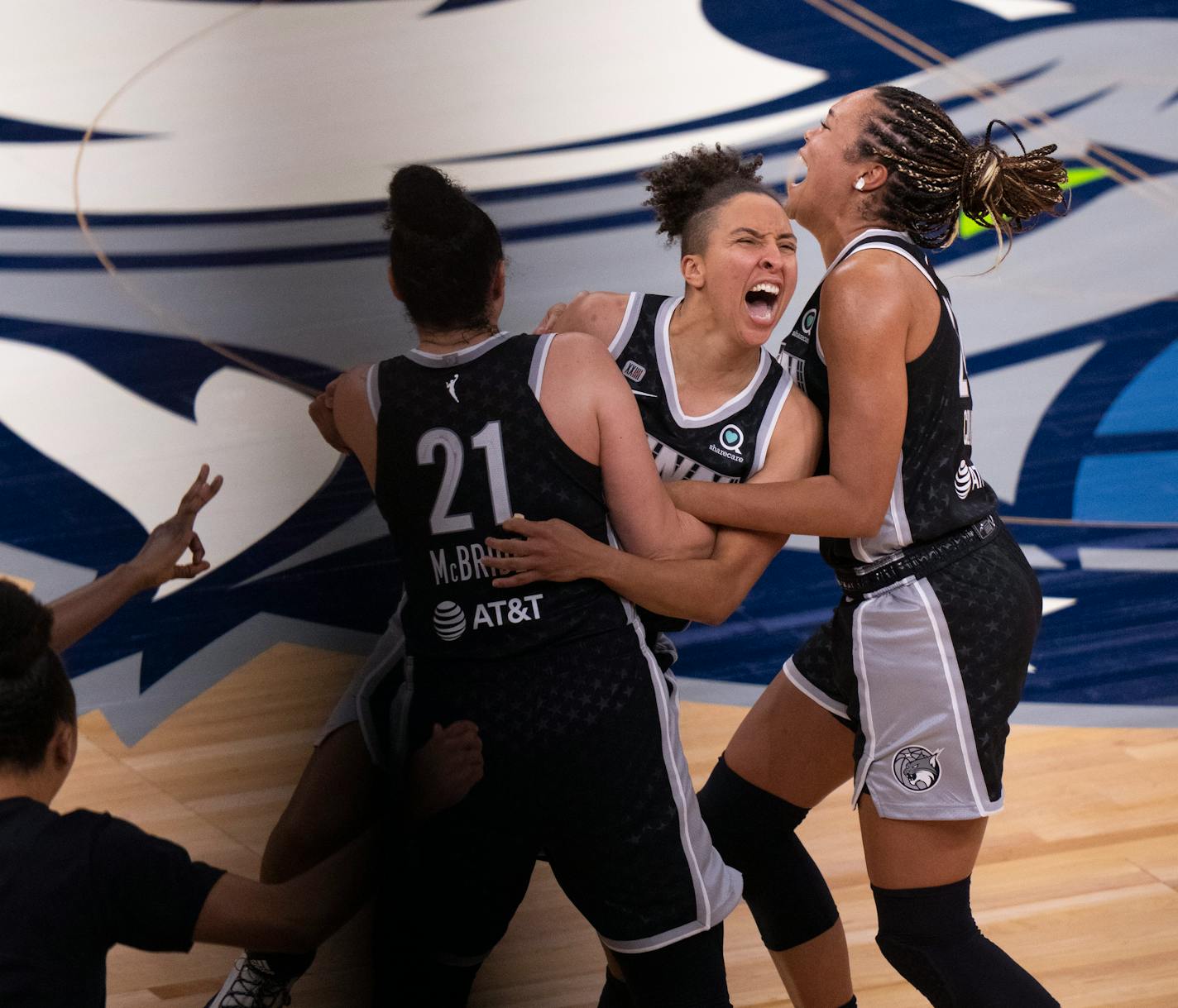 Lynx guard Layshia Clarendon (7), with Napheesa Collier (24) and Kayla McBride (21).