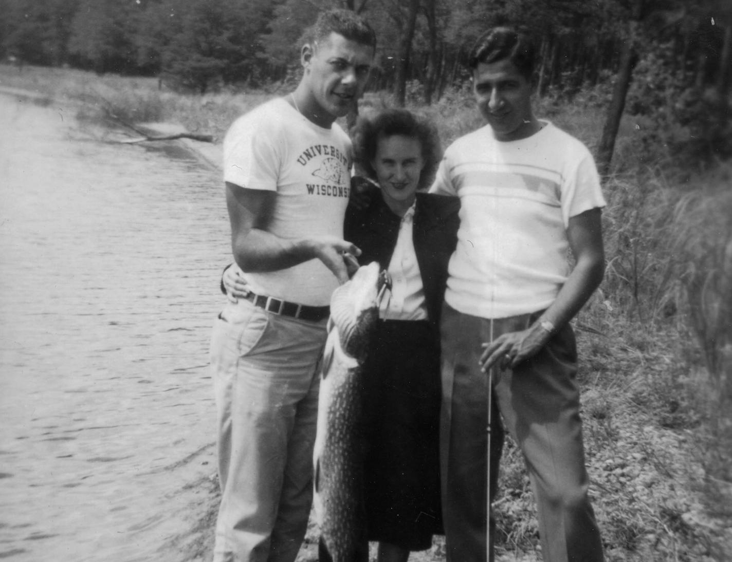 From the time he was in high school, Bud Grant traveled from his home in Superior, Wis., to the fish-laden lakes of northwest Wisconsin. In this photo he is wearing a University of Wisconsin T-shirt but he's enrolled at the U and playing three sports for U.