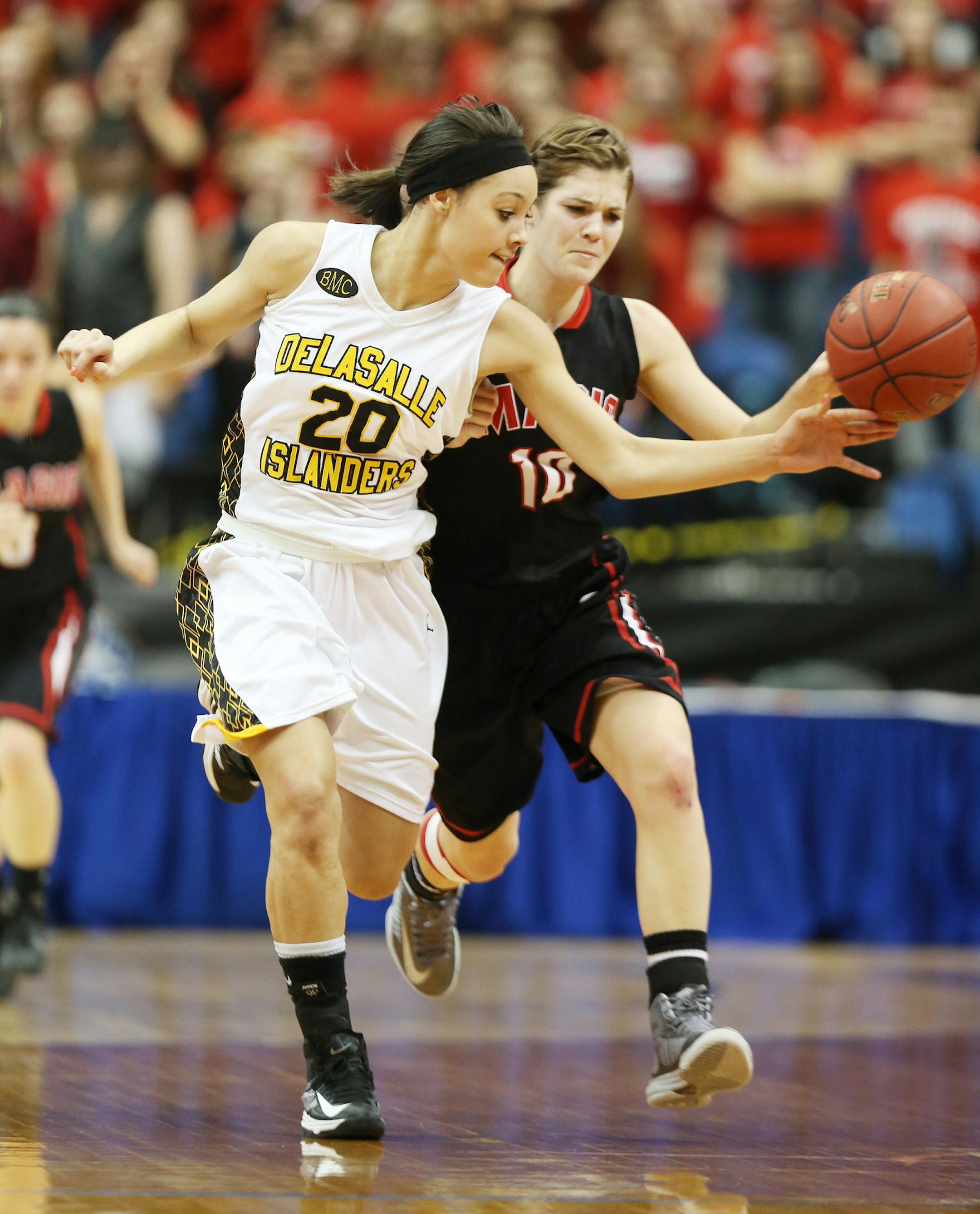 Claire Thomas of DeLaSalle tipped the ball away from Grace Sawatzke of Monticello during Class 3A girls semifinals basketball action between DeLaSalle and Monticello Thursday March, 14, 2012 at Target Center, in Minneapolis, MN. ] JERRY HOLT ‚Ä¢ jerry.holt@startribune.com