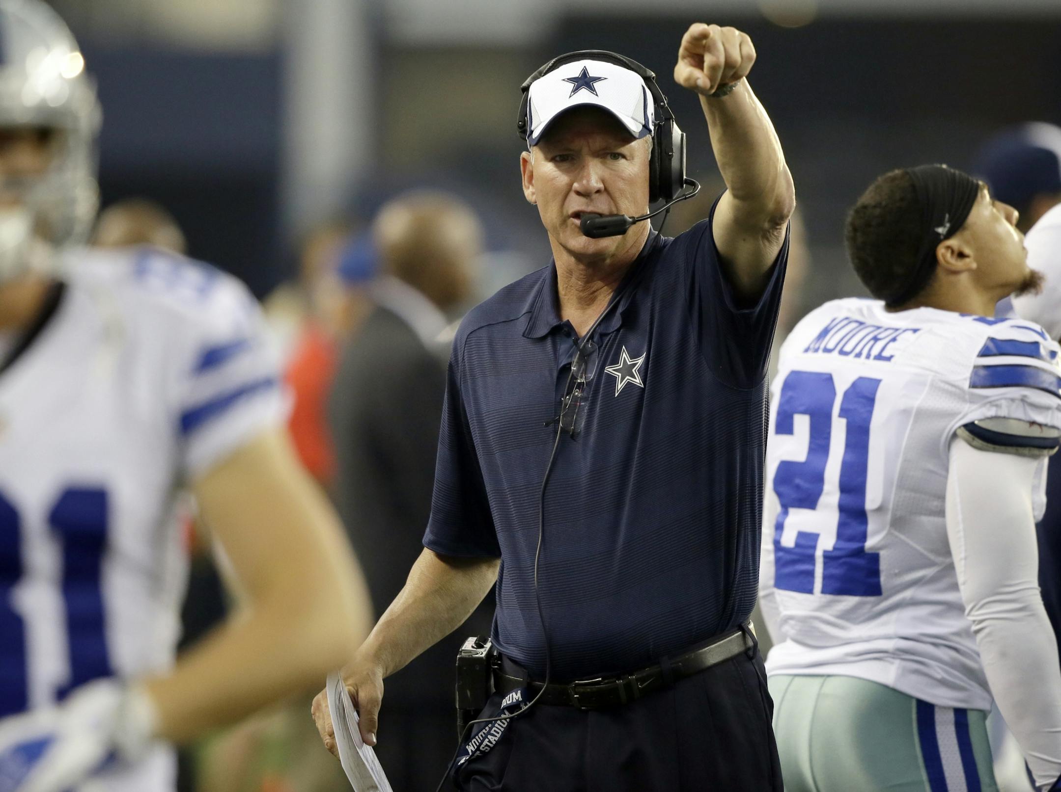 FILE - In this Aug. 29, 2013, file photo, Dallas Cowboys quarterback coach Wade Wilson calls a play during the first half of a preseason NFL football game against the Houston Texans in Arlington, Texas. The Cowboys say former NFL quarterback and longtime assistant coach Wade Wilson passed away Friday, Feb. 1, 2019, at his home in Coppell, Texas. The team didn't specify a cause of death for Wilson, who died on his 60th birthday.