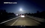 In this late Tuesday, Jan. 16, 2018, image made from dashcam video, a brightly lit object falls from the sky above a highway in the southern Michigan 