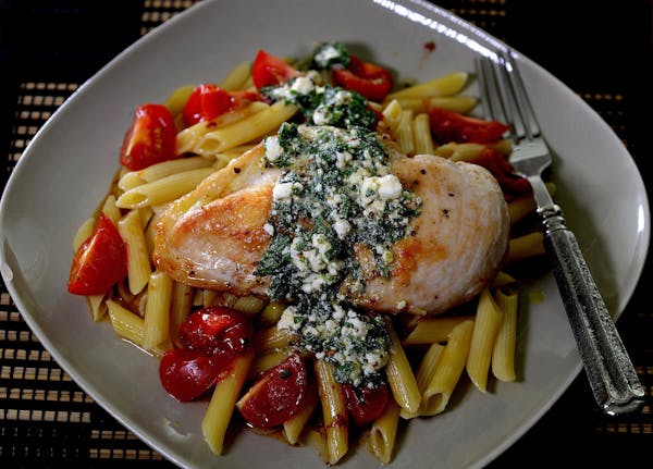 Golden brown chicken breasts top pasta with a goat cheese vinaigrette. (Diedra Laird/Charlotte Observer/TNS) ORG XMIT: 1197295