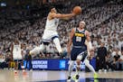 Timberwolves center Karl-Anthony Towns loses control of the ball in the first quarter of Game 4 against the Nuggets at Target Center.