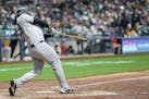 New York Yankees' Anthony Rizzo hits a two-run home run during the eighth inning of a baseball game against the Milwaukee Brewers Sunday, April 28, 20