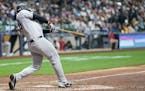 New York Yankees' Anthony Rizzo hits a two-run home run during the eighth inning of a baseball game against the Milwaukee Brewers Sunday, April 28, 20