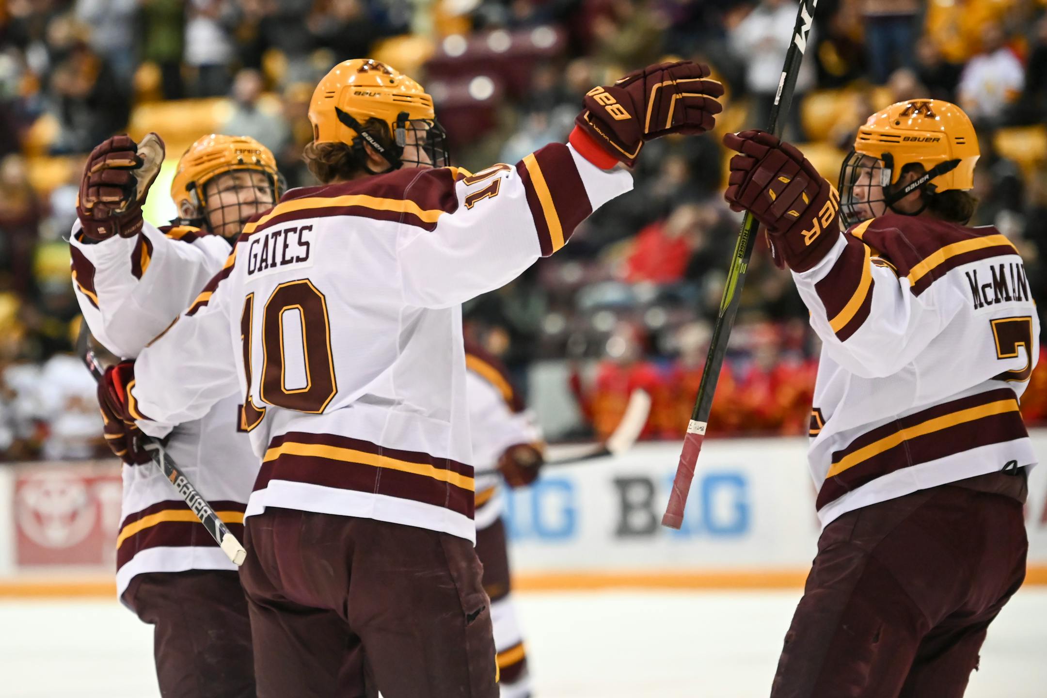 Teammates celebrated with Gophers forward Brent Gates Jr. after his first period goal against Ferris State in December.
