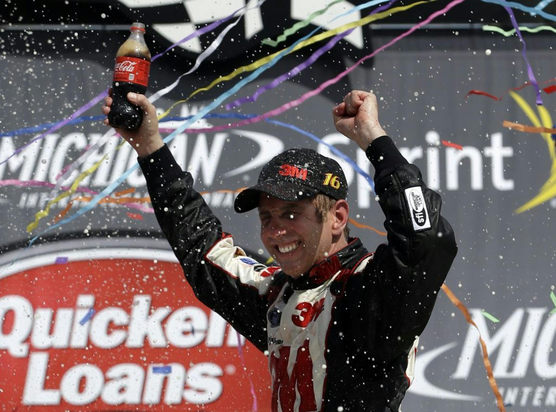 Sprint Cup Series driver Greg Biffle celebrates his win in the NASCAR Quicken Loans 400 auto race at Michigan International Speedway, Sunday, June 16, 2013 in Brooklyn, Mich.