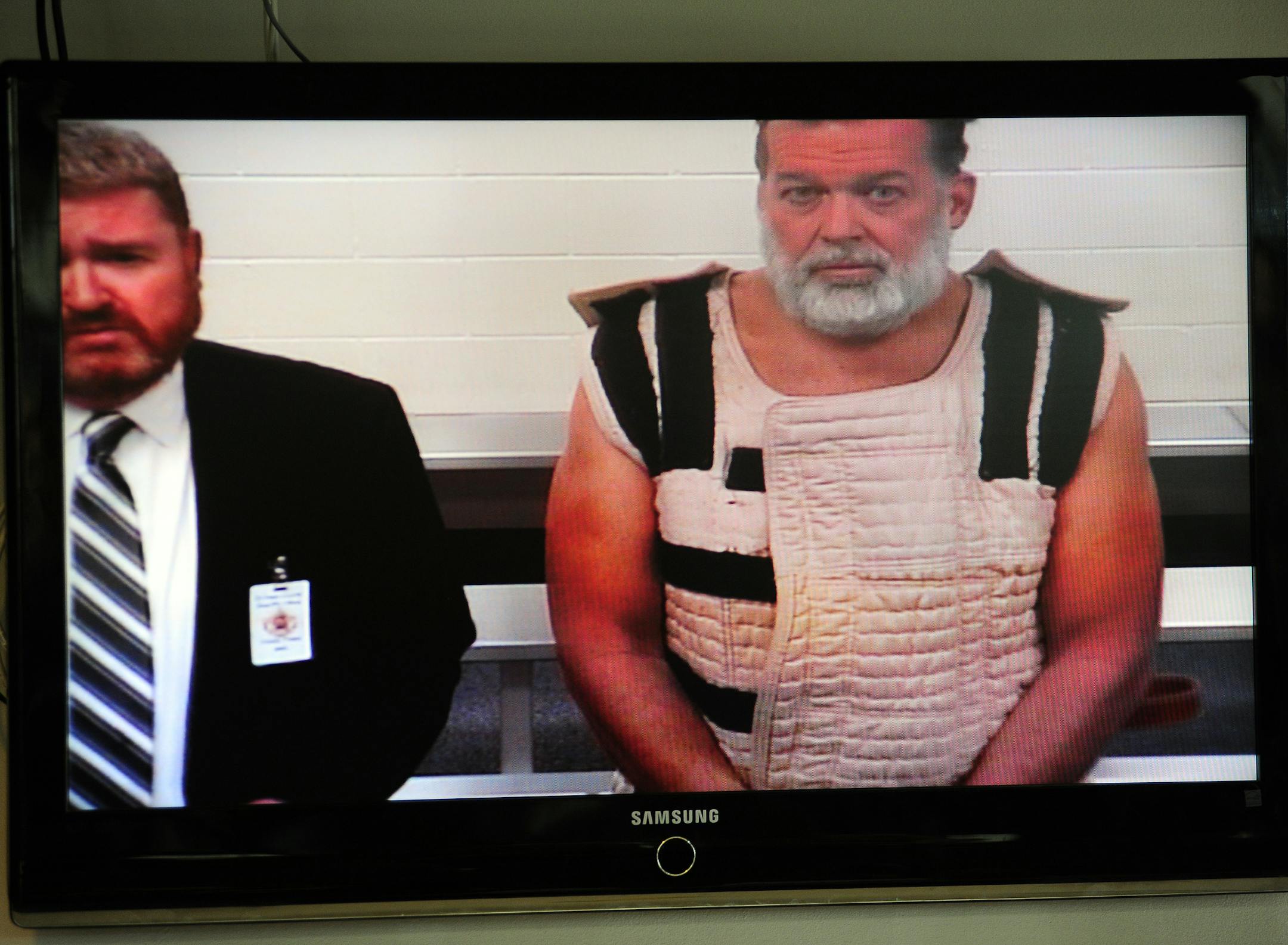 Colorado Springs shooting suspect, Robert Dear, right, appears via video before Judge Gilbert Martinez, with public defender Dan King, at the El Paso County Criminal Justice Center for this first court appearance, where he was told he faces first degree murder charges, n Monday, Nov. 30, 2015, in Colorado Springs, Colo. (Daniel Owen/The Gazette via AP, Pool)