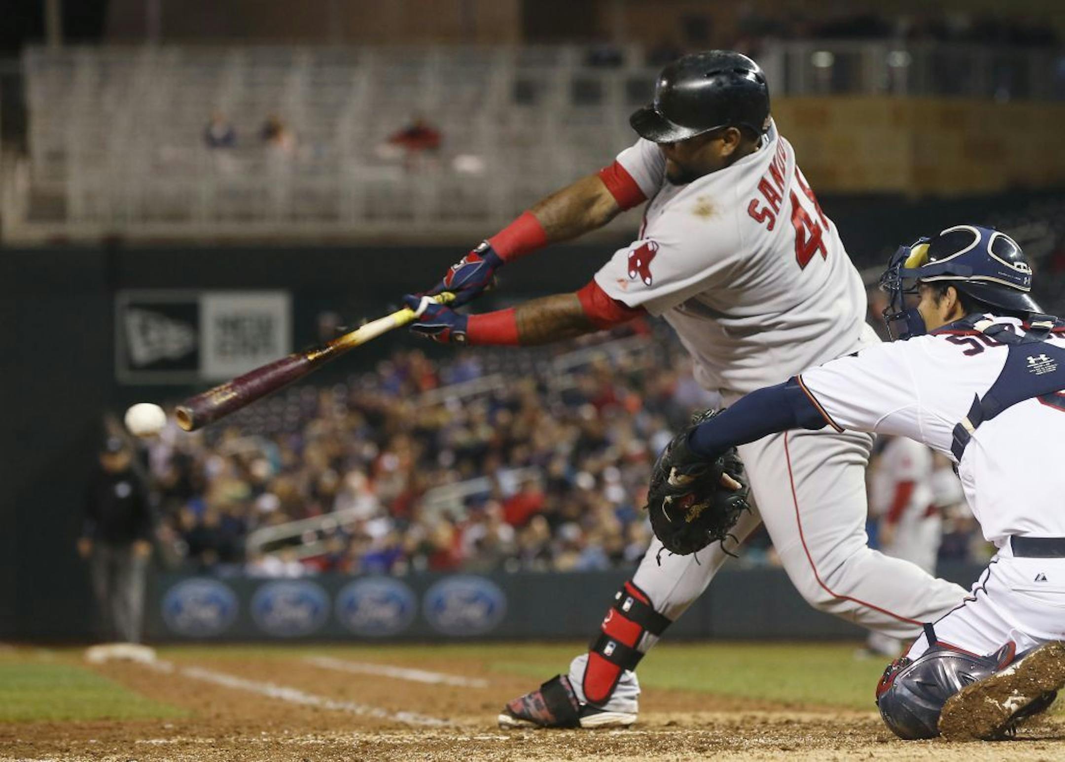 Boston Red Sox's Pablo Sandoval hits a single off Minnesota Twins pitcher Glen Perkins to load the bases in the eighth inning of a baseball game, Tuesday, May 26, 2015, in Minneapolis. The Twins won 2-1.