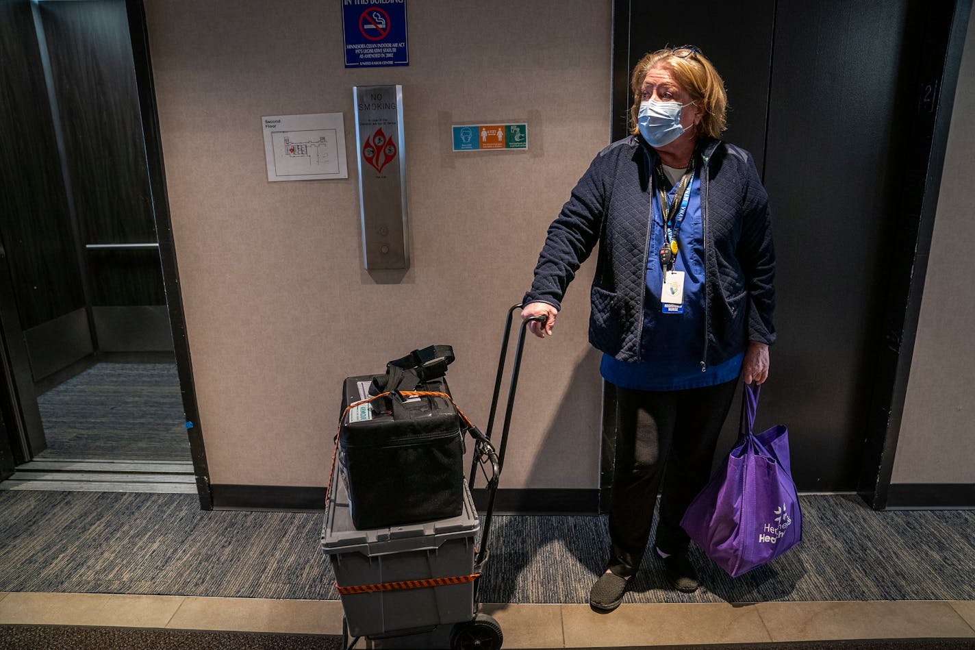 Christine Runyon, a nurse with Hennepin Healthcare, left with her supplies and the extra vials of Moderna COVID-19 vaccine at the end of the clinic at United Labor Center. ] LEILA NAVIDI • leila.navidi@startribune.com