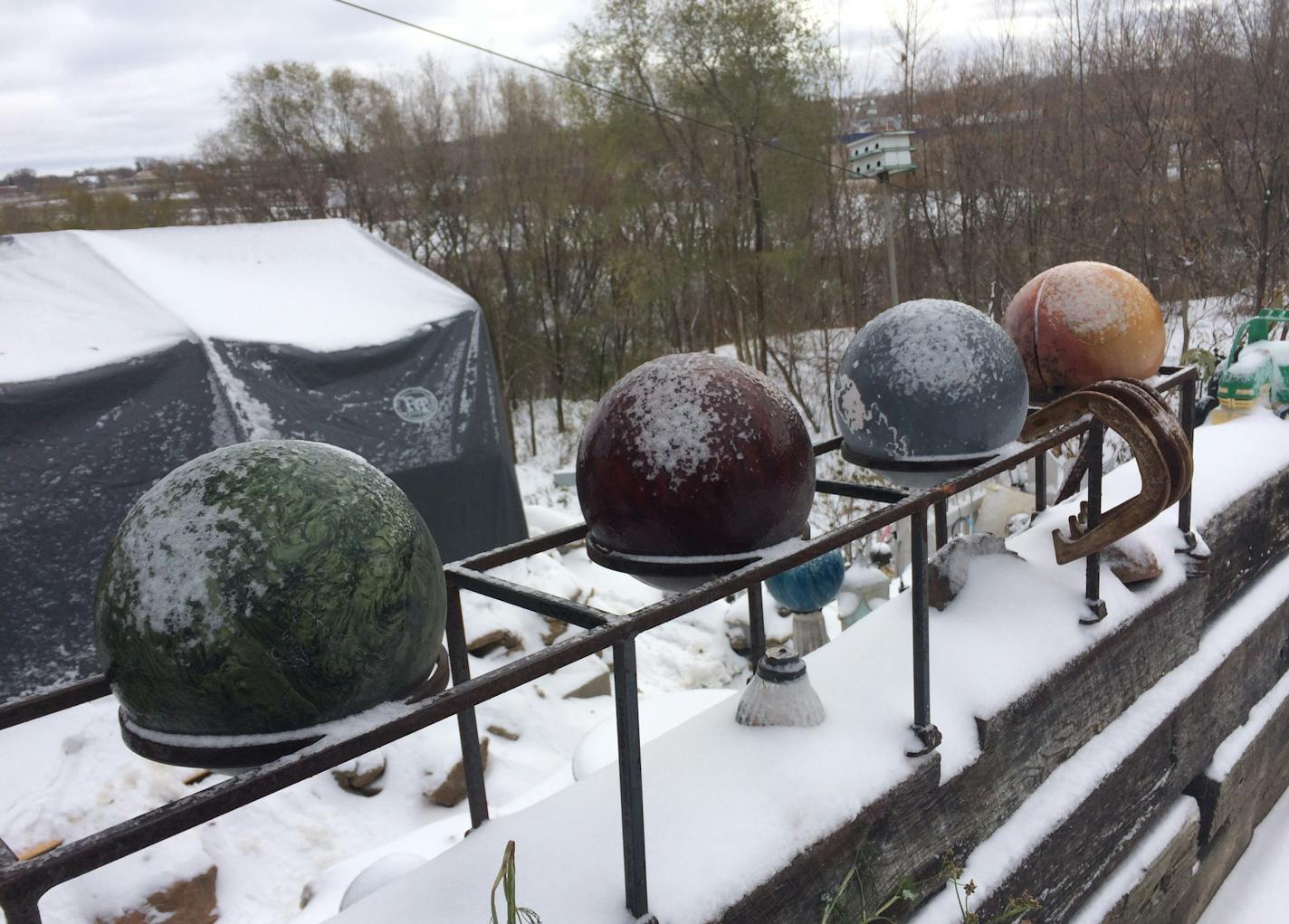 Arjo Adams' property in St. Paul is a sculpture garden of his own creation, in this case displaying four bowling balls al fresco. The sculpture park sprawled onto a neighboring lot until the city removed it.