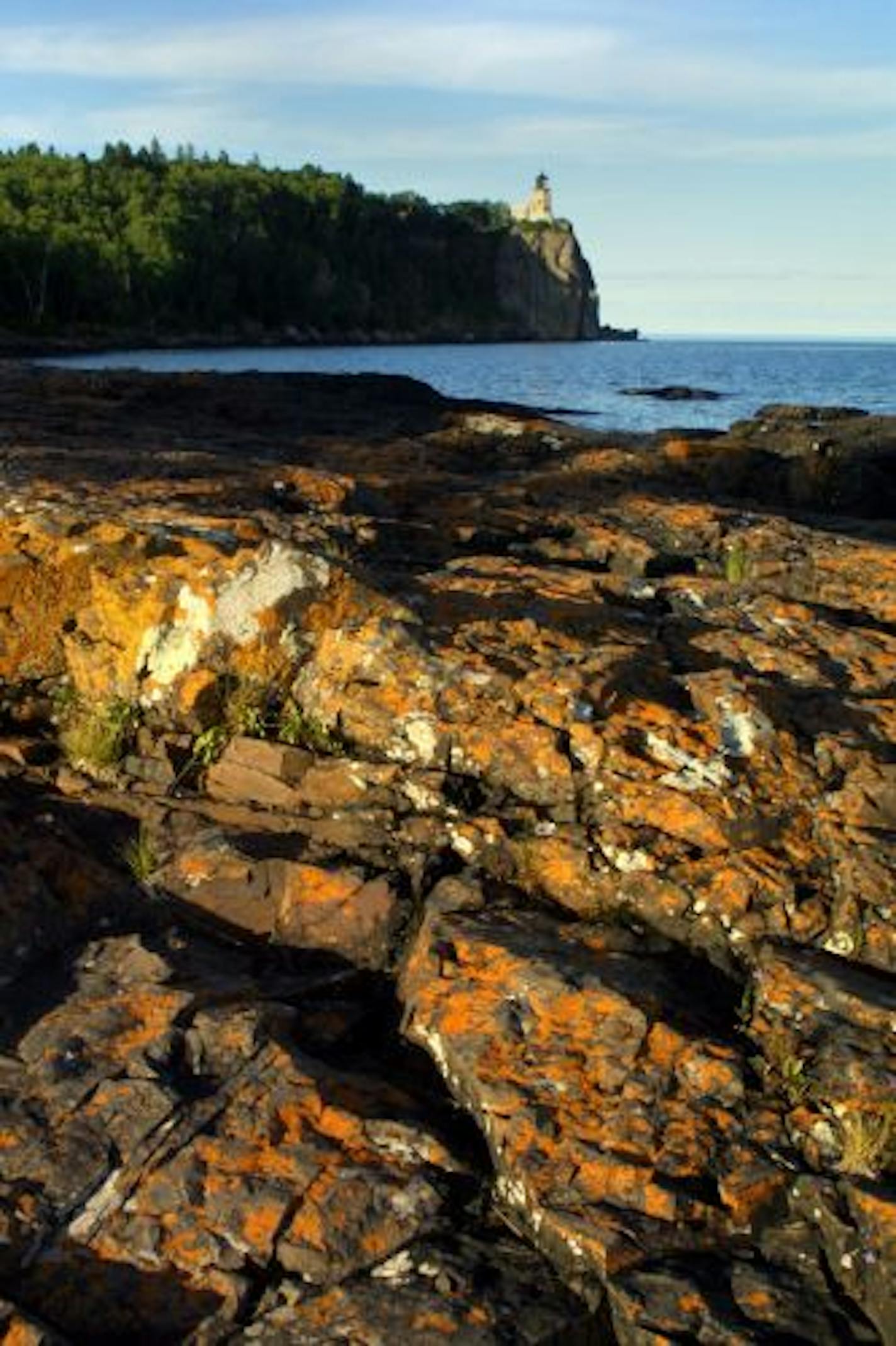 Split Rock State Park: Evening sunlight highlighted patterns on the iron shores of Lake Superior beneath the famous light house.