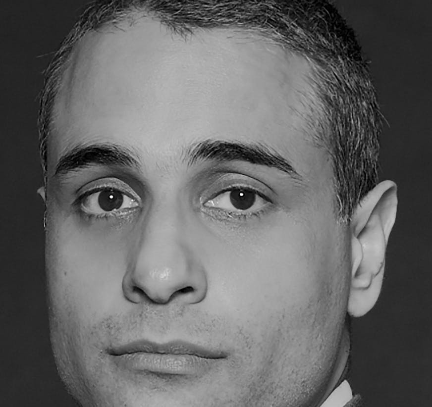 black and white photo of author Siddharth Kara