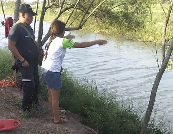 Tania Vanessa Ávalos of El Salvador speaks with Mexican authorities after her husband and nearly two-year-old daughter were swept away by the current