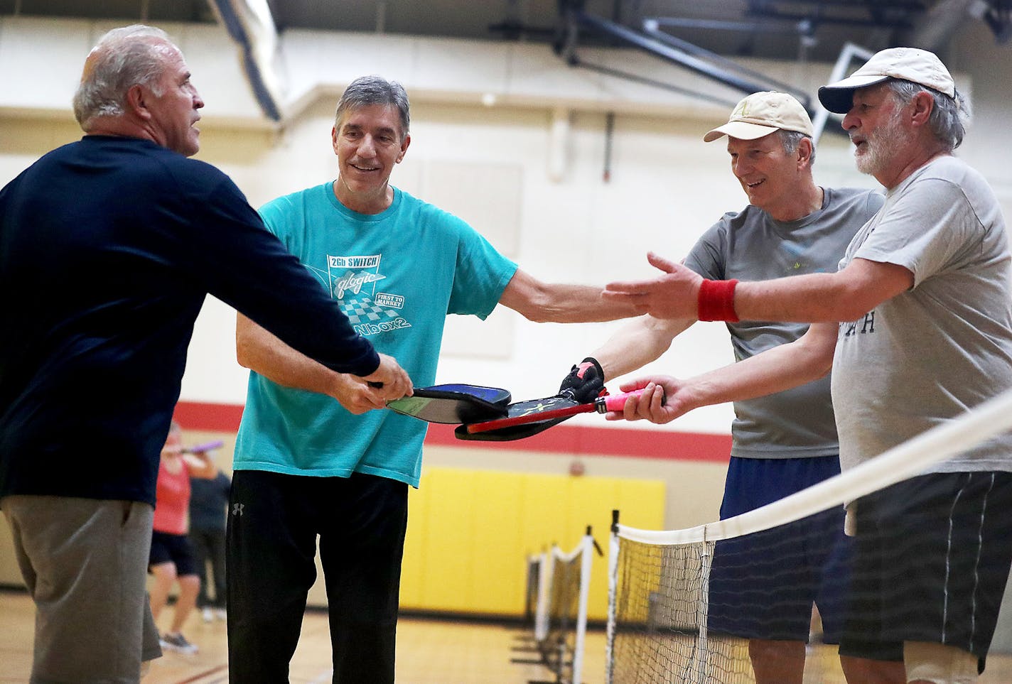 The Burnsville Community Center was brimming with pickle ball games, including one game that ended as players Darrell Goring, left to right, Bill Gustafson, Jurgen Adam and Tom Turck, shook hands Thursday, March 21, 2019, in Burnsville, MN.] DAVID JOLES &#x2022;david.joles@startribune.com The senior citizen-friendly sport of pickleball is causing controversy in Apple Valley, where residents whose homes abut a popular city pickleball court say the noisy sport has been making them crazy for years.