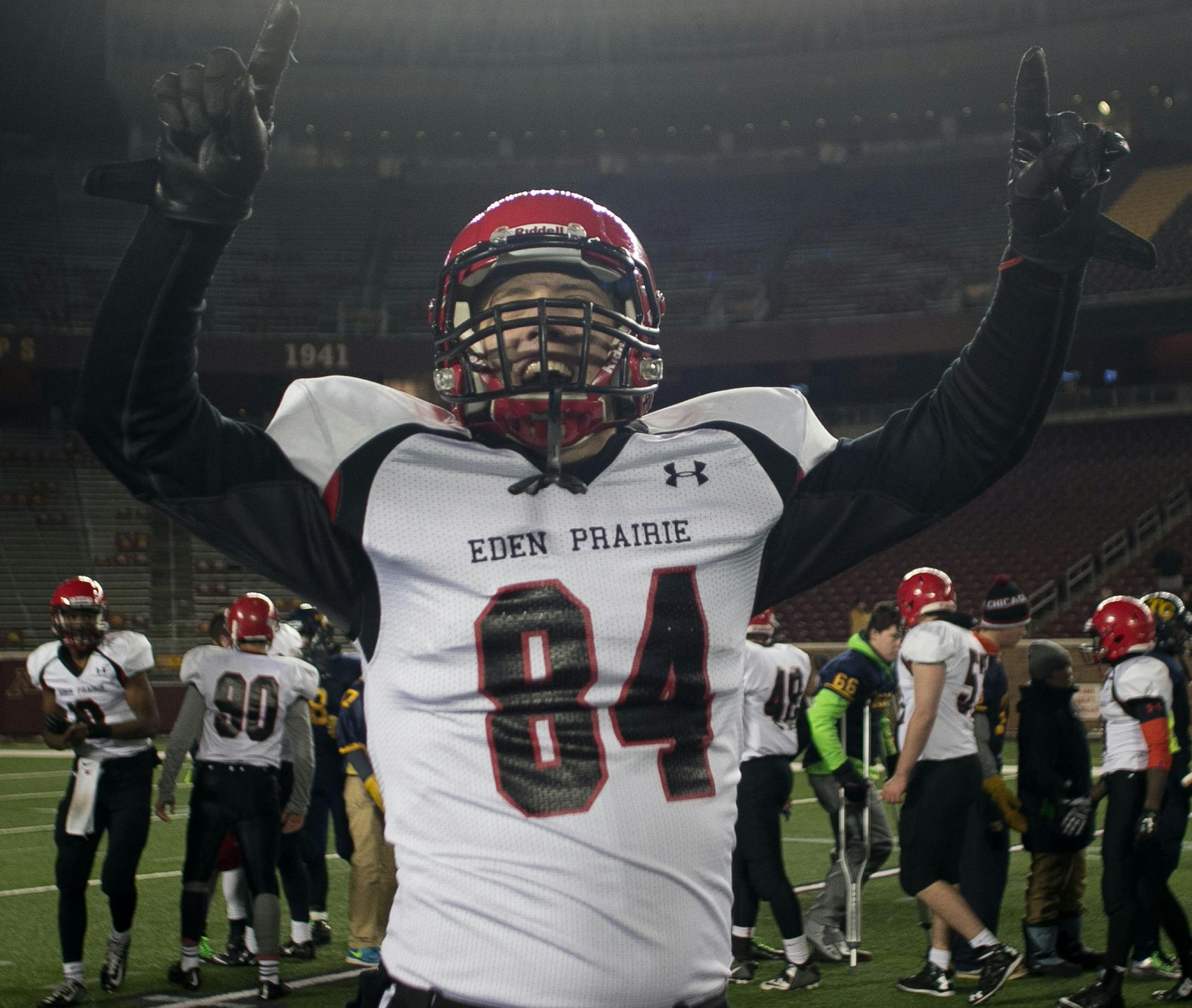 Eden Prairie tight end Robbie Olson gestures to fans after his team's 28-27 victory over Totino-Grace Friday night in the Class 6A Prep Bowl. ] AARON LAVINSKY • aaron.lavinsky@startribune.com Totino-Grace takes on Eden Prairie in the Class 6A Prep Bowl Friday, Nov. 21, 2014 at TCF Bank Stadium.