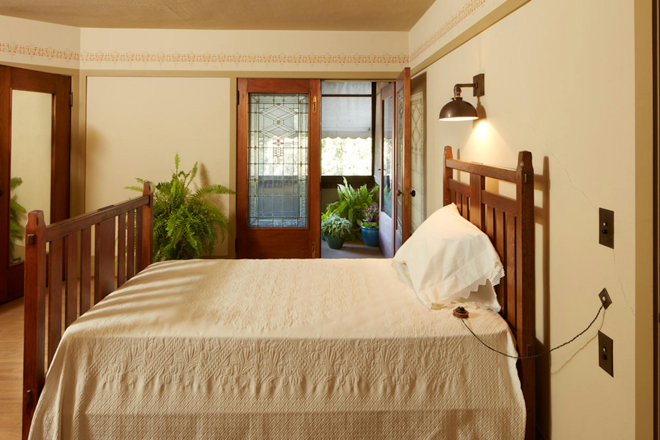 Purcell-Cutts House, 2328 Lake Place, Minneapolis, Minnesota, 1913, William Gray Purcell, Architect.George Elmslie, George Feick Jr. partners in firm Purcell, Feick and Elmslie, Edna S. Purcell House, Prarie School Style, Open floor plan, Art Glass windows, Writing Nook, Fireplace wall Mural by Charles Livingston Bull, Louisana Herons Flying with two Moons, Iridescent glass mortered in frieplace base, Stencil pattern, Peak a Book stained glass entry, Grandfather Gray portrait by Lawton Parker in Entrance Hall, Dining room Art Glass double door to screend-in Porch, Reflecting Pool and landscape designed by Harry Franklin Baker, Living room, Stair Hall, Master Suite, Sleeping Porch, Built in cedar floor storage, fireplace, childrens room connected to master with accordian style operating partition, sunken Living room,tent Ceilings, Ceiling Lights and art glass by Mosaic Art Shops Minneapolis, Maid Call Button, Air conditioning, Central vacuum system, sliding kitchen door operated by foot button, icebox in kitchen with door to outside, custom Sitting chair, Custom Floor lamp, Custom Dining room table,chairs and sideboard, Custom Cluster Pendant lighting, Oak hardwood floors and trim, Custom Throw rugs, Continuous tented roof and ceiling, Elevated dining room, dropped floor living room, "Little Joker", Personalized home with monogram ESP for Edna S. Purcell,