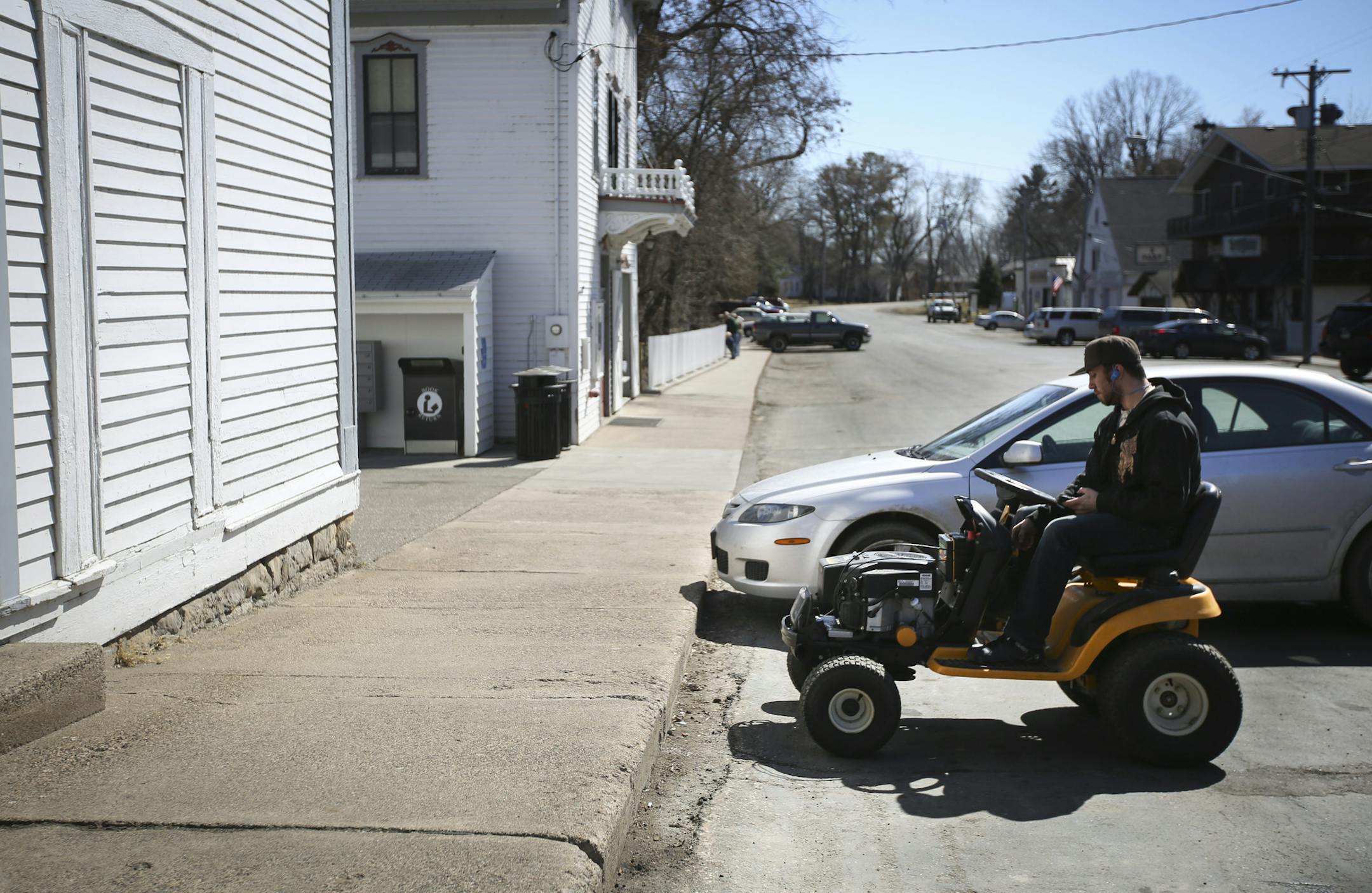 A man drove up on a lawn mower at The General Store in Marine on St. Croix, Minn., on Friday, March 27, 2015. ] RENEE JONES SCHNEIDER • reneejones@startribune.com NO ID sorry!