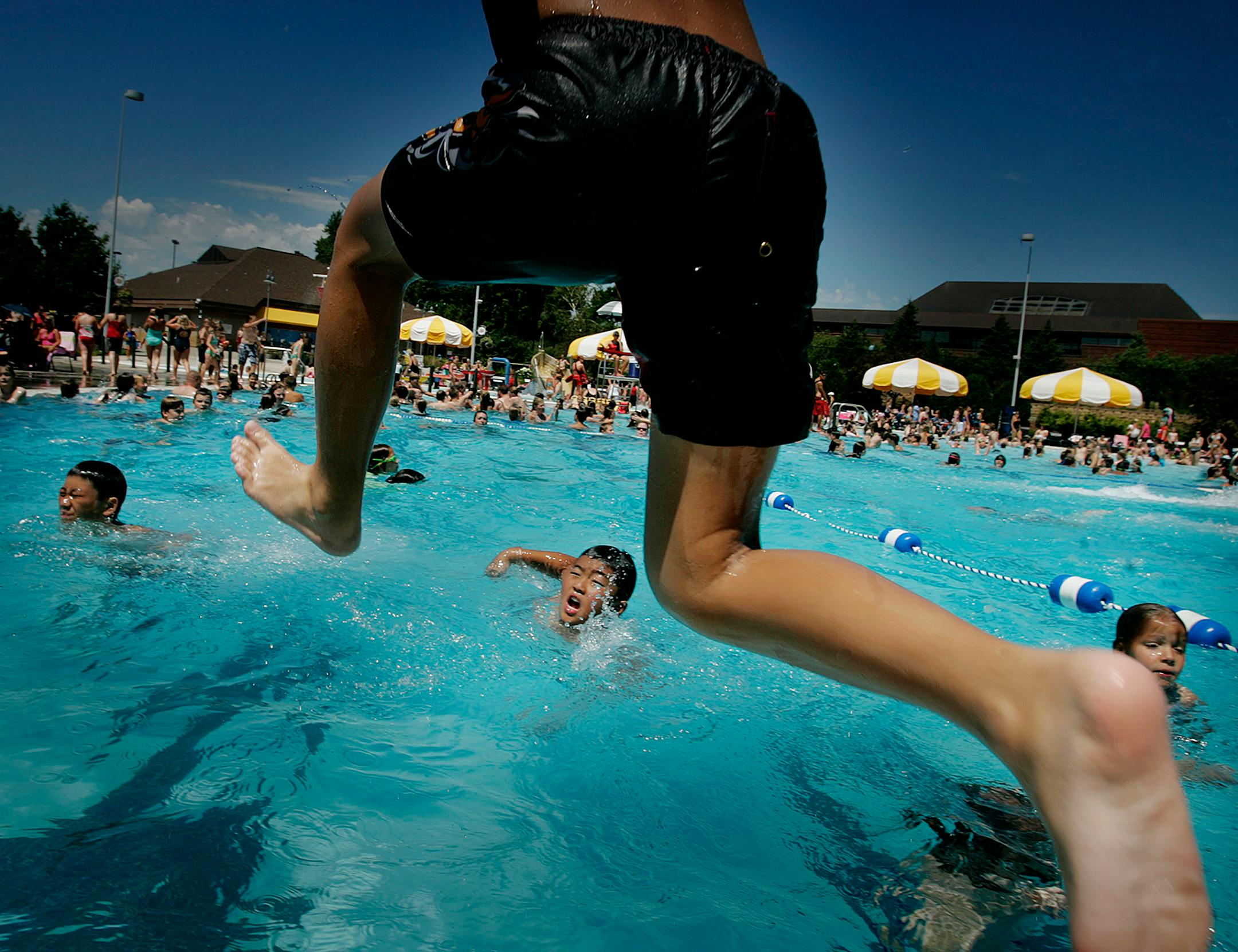 Kids from the St. Paul Salvation Army summer day camp cooled down Tuesday at Cascade Bay in Eagan. A study finds that at age 9, the average kid is physically active for three hours a day, but by 15, that drops to less than an hour a day.