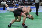 Stillwater's Hunter Lyden takes down Northfield's Darrin Kuyper during a 170lb 3A bout during the Minnesota State High School Wrestling quarterfinals 
