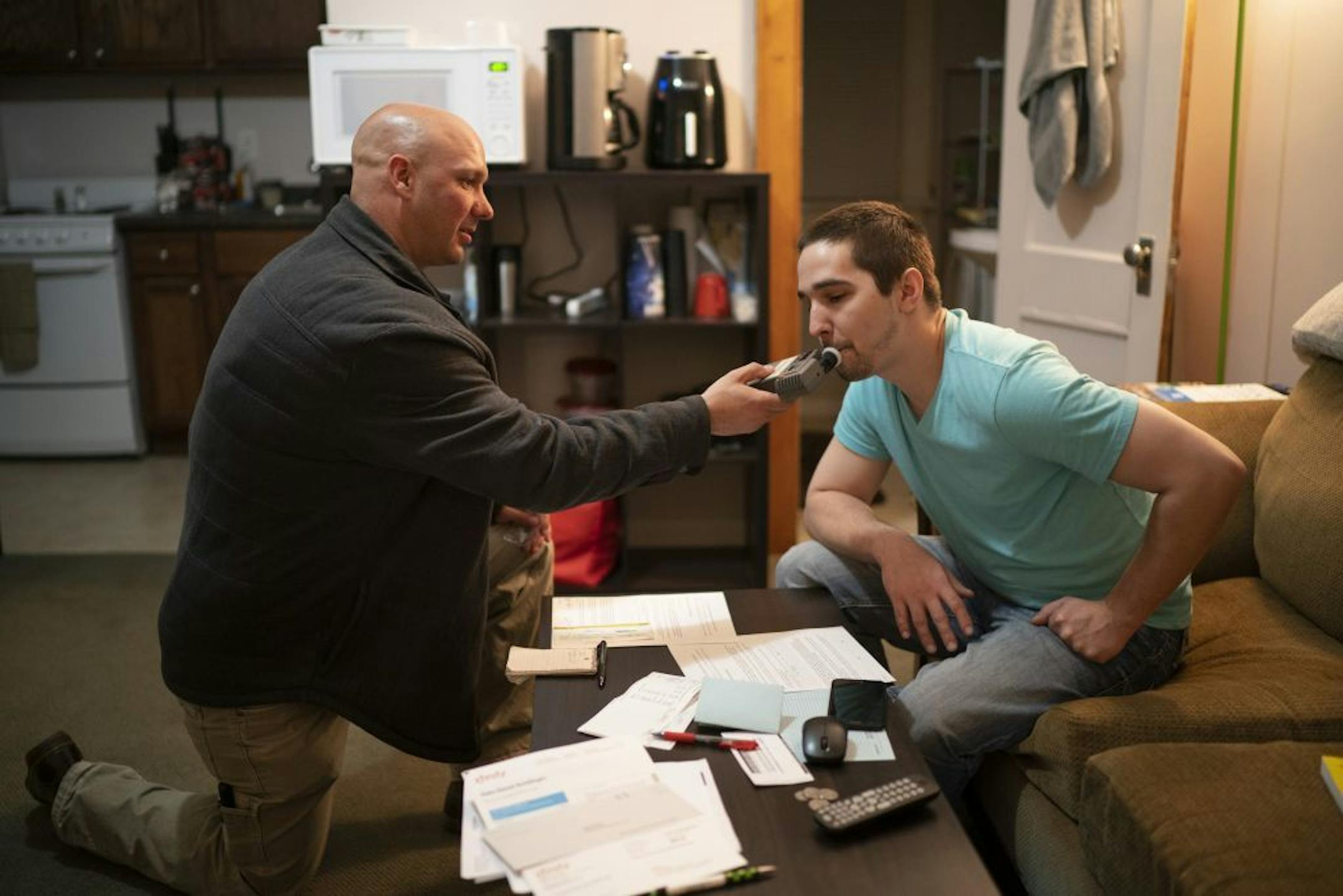 Former prison inmate Daniel blew into a breathalyzer during a random visit Monday night by ISR Agent Ricardo Defiel to his north Minneapolis apartment. Defiel and Daniel completed paperwork for him to enter Phase III of his supervised release, which is the final six months of the program.