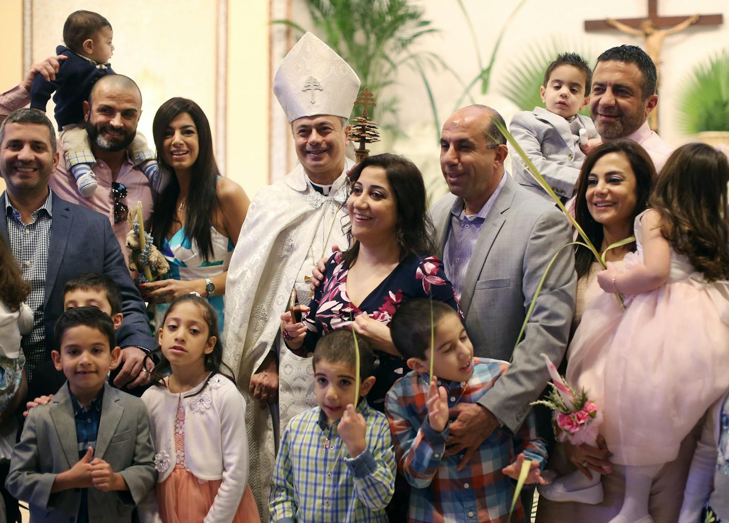 Pastor Sharbel-Ghattas Maroun posed for photos with church members after Palm Sunday services at Maron's Catholic Church March 20, 2016 in Minneapolis MN. ] Jerry Holt/Jerry.Holt@Startribune.com