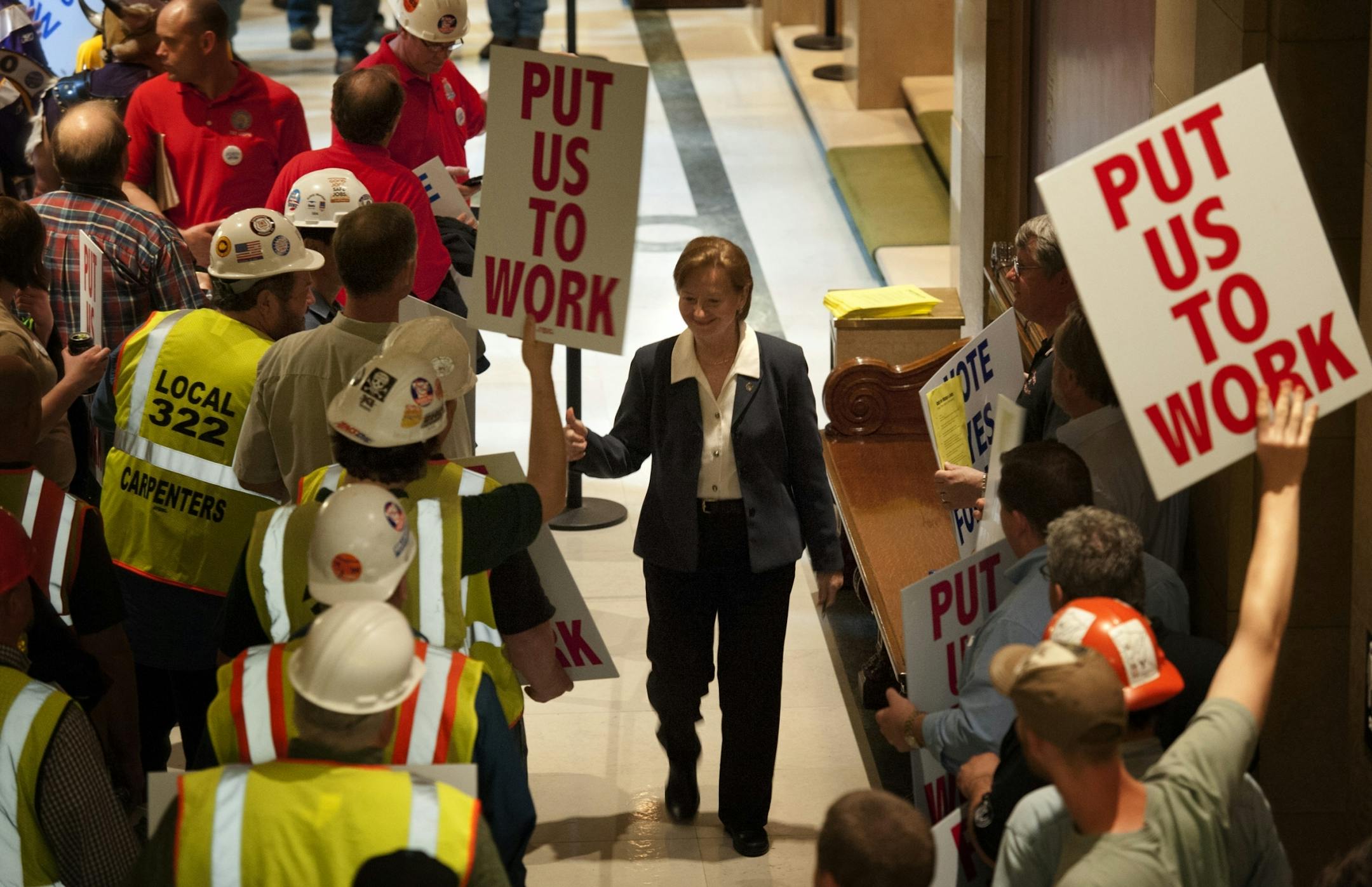 Rep. Bev Scalze, DFL Little Canada, greeted Union members who chanted "Build it! Build it!" outside the House chamber where they were discussing the bonding bill at the Capitol Thursday, May 3, 2012.