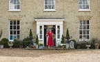 Paula Sutton in front of Hill House, her 19th-century home in Norfolk, England. MUST CREDIT: Simon Brown/Clarkson Potter
