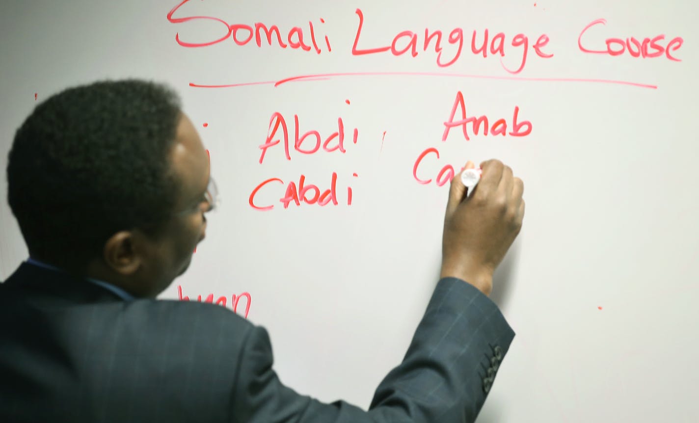 Ali Warsame, right, taught Metro transit cops the Somali alphabet during a Somali language class, Wednesday, March 2, 2016 in st. Paul, MN. ] (ELIZABETH FLORES/STAR TRIBUNE) ELIZABETH FLORES &#x2022; eflores@startribune.com