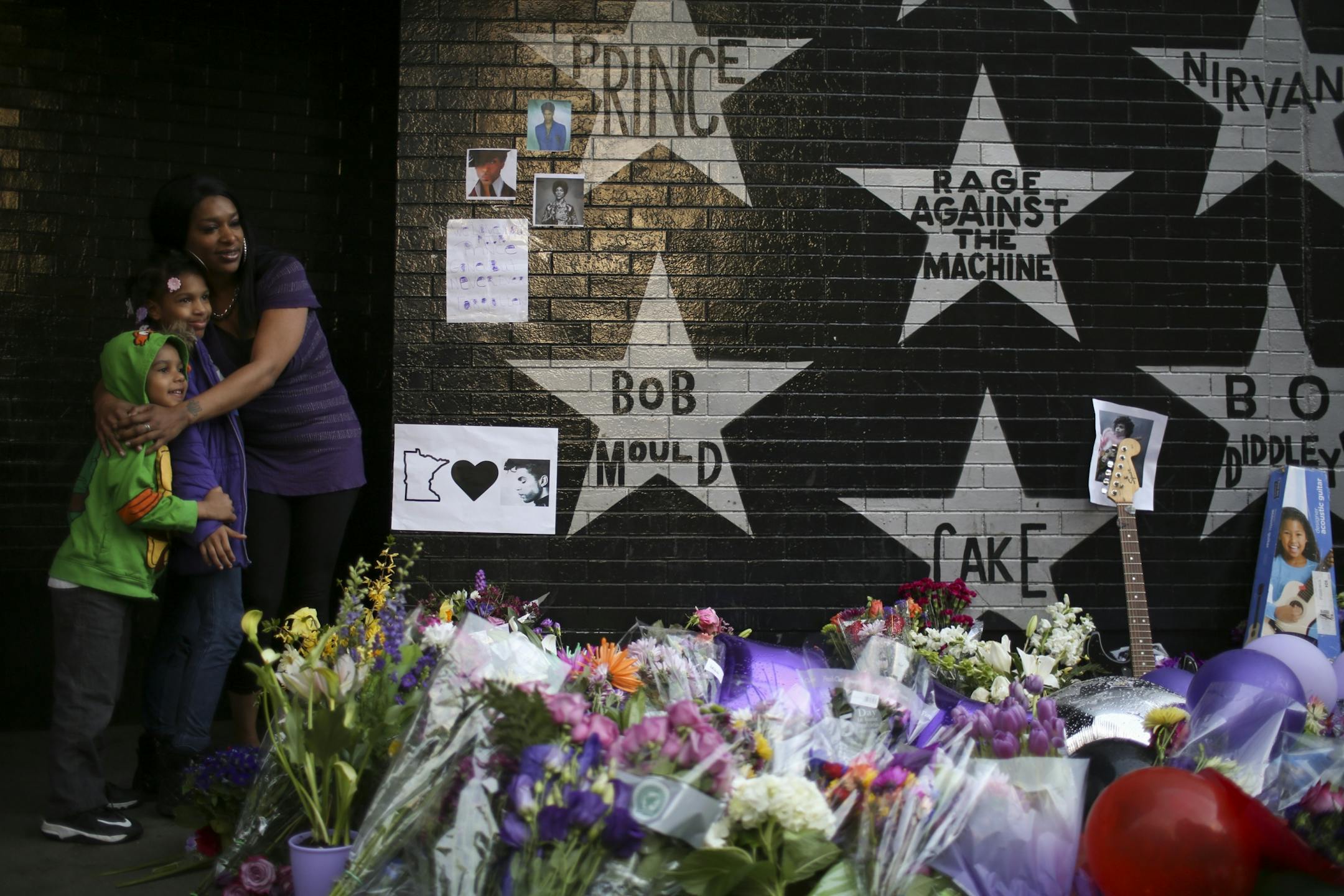 The growing memorial under Prince's star at First Ave. drew multitudes of fans throughout Tuesday afternoon and evening.