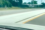 Screenshot from a video of the plane landing on a Blaine road, captured from inside a vehicle.