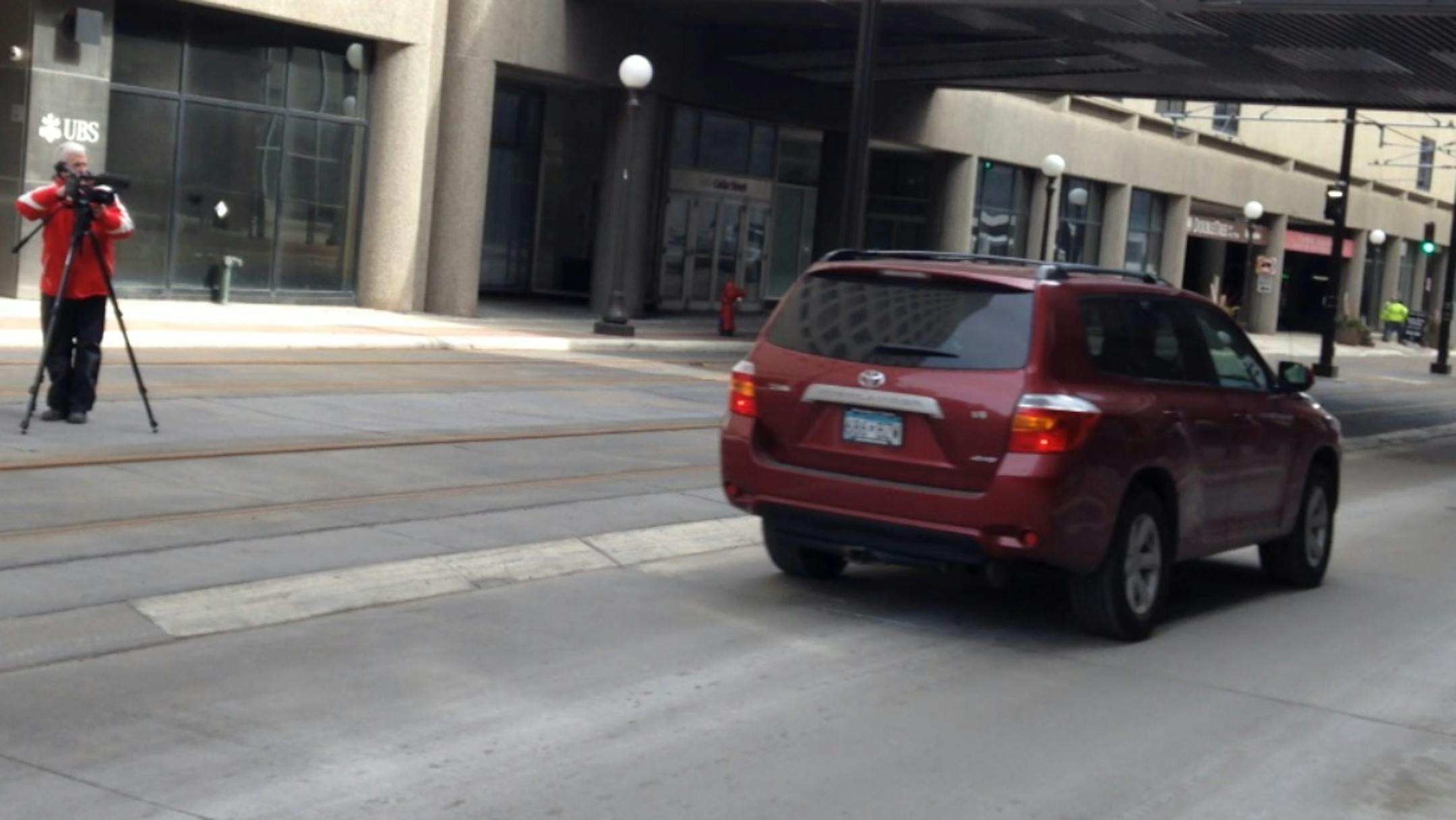 Archbishop John Nienstedt leaves after giving his deposition Wednesday afternoon.