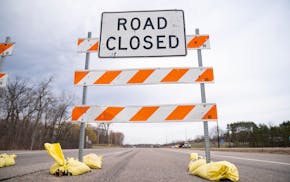 Road closed sign on highway.